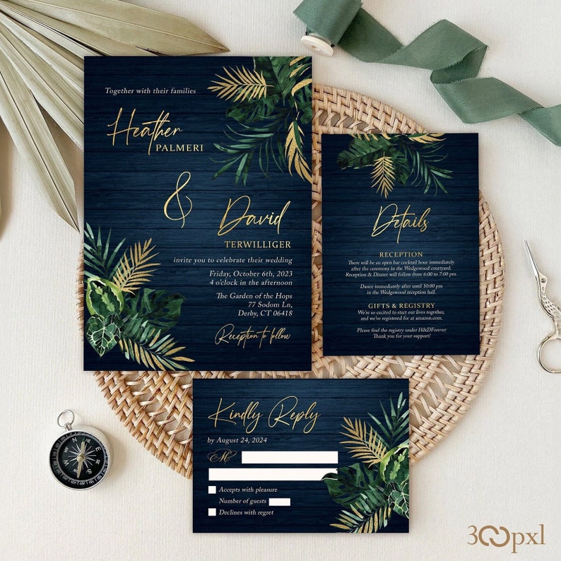 Moody tropical wedding invitation with emerald green foliage and gold palm leaves.