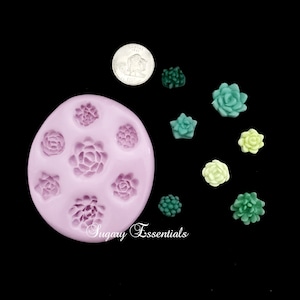 May include: A round light purple silicone mold featuring eight distinct succulent and floral cavities, accompanied by seven small molded succulent shapes in shades of green and yellow, and a silver US nickel for scale reference.