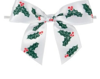 May include: White satin bow with a green holly leaf and red berry pattern.