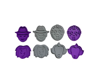 May include: Set of eight purple and gray cookie cutters featuring horror movie characters. The cutters are shaped like the faces of Jason Voorhees, Freddy Krueger, and Pennywise the Clown.