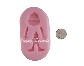 May include: Pink silicone mold for making a Grinch character cake topper. The mold is about the size of a US quarter. The mold has a separate head, body, and arms. The mold is labeled "Sugary Essentials".