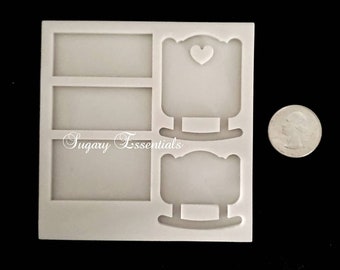 May include: A white silicone mold featuring three rectangular cavities and two rocking chair shapes, one with a heart cutout. The text Sugary Essentials is embossed on the mold. A US quarter coin is placed next to the mold for scale reference.