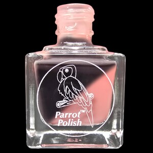 May include: A clear, square nail polish bottle with a pink cap. The bottle contains two colors, a dark purple and a light pink. A white circular label features a parrot illustration and the text "Parrot Polish".