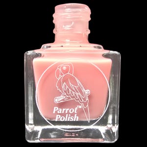 May include: A clear, square nail polish bottle filled with a light pink polish. The bottle features a white circular label with a parrot illustration and the words "Parrot Polish". The bottle has a clear, pink cap.