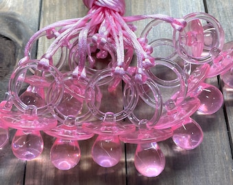 baby shower pink pacifiers with pink string party favors for game