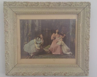 Old frame with raised effect Technique made of plaster Young woman with violin