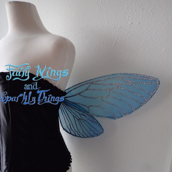 Custom Aqua and cerulean blue Navi inspired Adult fairy wings with holographic silver glitter perfect for cosplay or fairy costumes