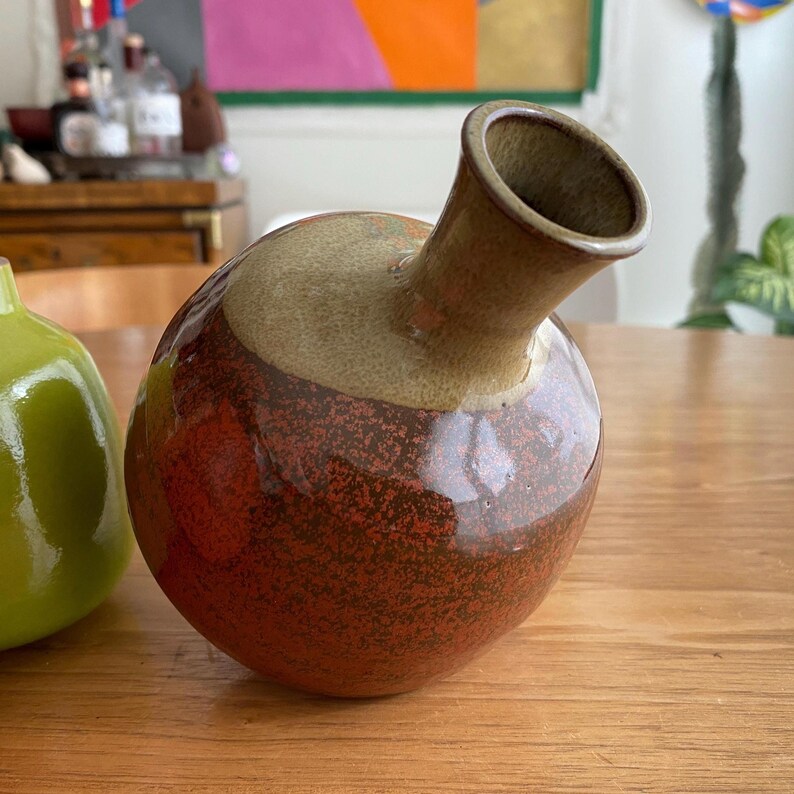 A ceramic vase with a rounded body.