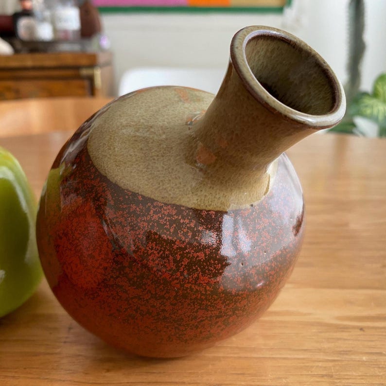 A ceramic vase with a rounded body.