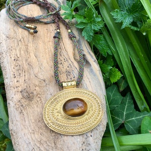 Tribal Style Brass Tigers Eye Necklace · Macrame Amulet · with green brown contrasting threads · Bohohemian Style