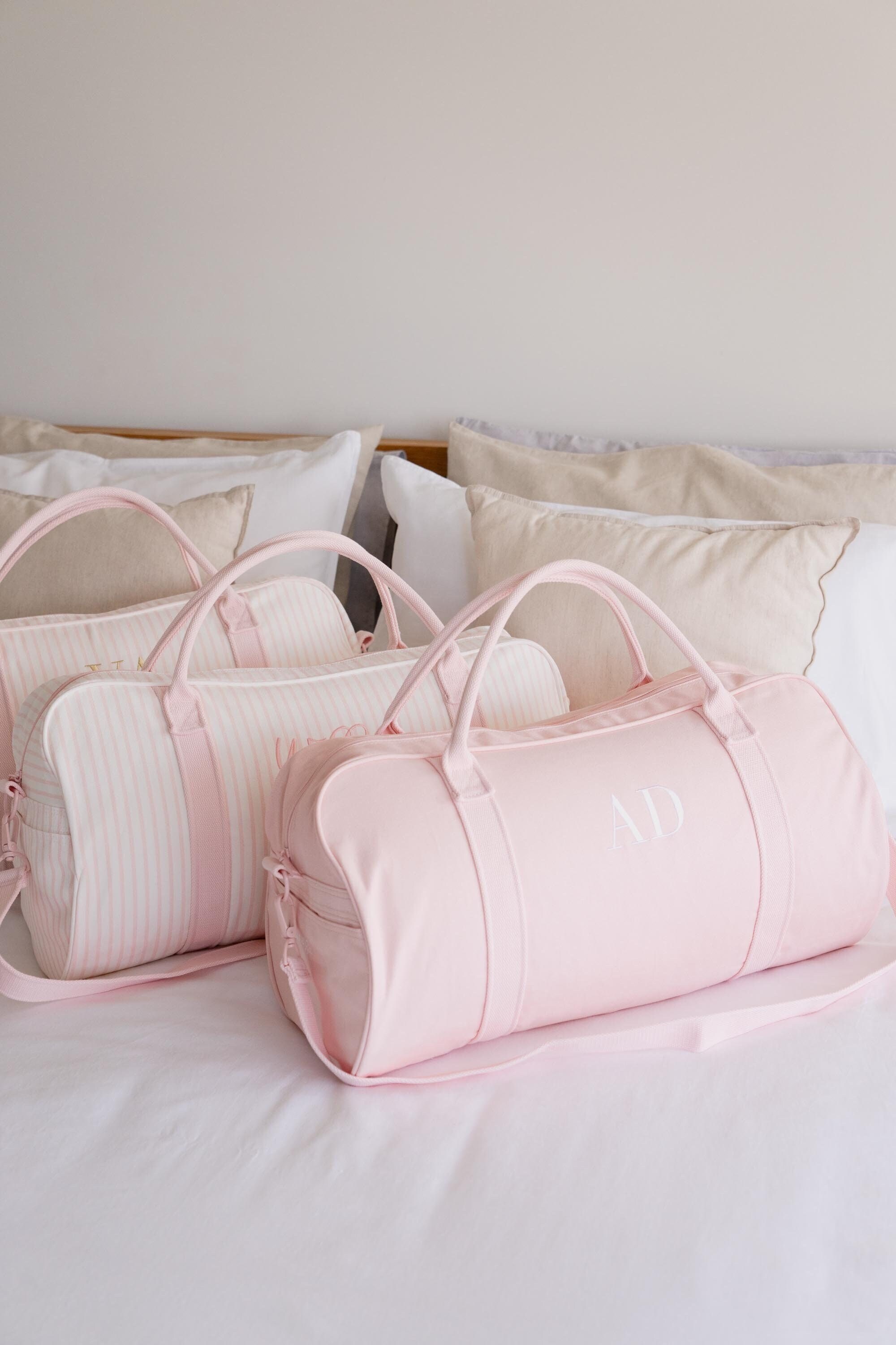 Pink duffle bags best sale