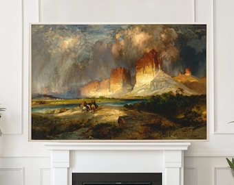 May include: An interior scene featuring a framed landscape painting above a white fireplace. Two emerald green velvet armchairs with gold bases flank the fireplace. A glass coffee table and potted plants complete the room's decor.
