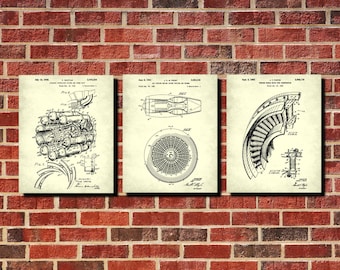 May include: Set of three framed vintage-style prints featuring detailed diagrams of jet engine components. The prints are in black and white, with technical drawings and text on a cream-colored background. The frames are not visible.