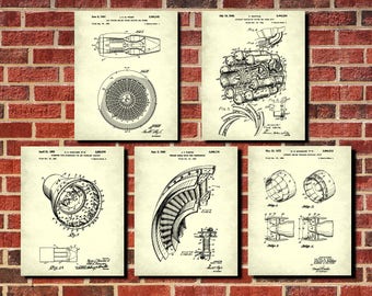 May include: Five framed vintage patent prints of jet engine designs. The prints are in black and white, with detailed technical drawings. The prints are arranged on a red brick wall.