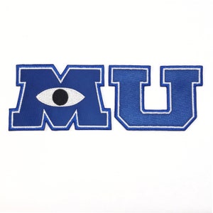 May include: Blue and white embroidered patch with the letters "MU" with an eye in the "M".