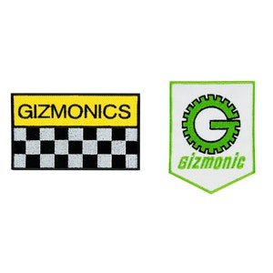 May include: Two embroidered patches, one yellow with black checkered racing flag and the text "GIZMONICS", the other white with a green gear and the text "gizmonic"