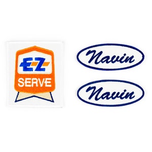 May include: Three embroidered patches. One patch is orange and white with the text "EZ SERVE" and a blue and white logo. The other two patches are white with blue embroidered text that says "Navin".