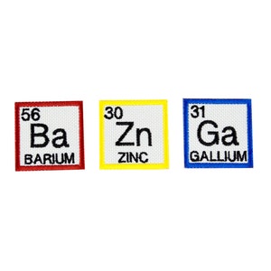 May include: Three embroidered patches featuring the chemical elements Barium, Zinc, and Gallium. Each patch has a white background with black text and a colored border: red, yellow, and blue.