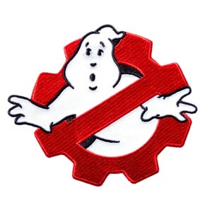 May include: Embroidered patch featuring the Ghostbusters logo. The design includes a white ghost figure inside a red, gear-shaped emblem with a red slash through it. The patch is suitable for jackets, bags, or other fabric items.