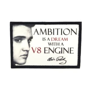 May include: Black and white image of Elvis Presley with the text "Ambition is a dream with a V8 engine" and his signature below.