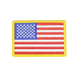 May include: Embroidered patch featuring the American flag. The patch has a blue canton with white stars and red and white stripes. It is bordered by a yellow stitched edge.