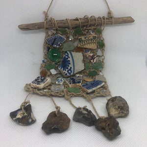 Handmade embroidered Dreamcatcher with Hag stones, white clay stem pipes vintage nails seaglass beads old buttons Victorian ceramic shards
