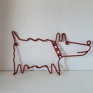 Red metal Ikea coat rack, dog