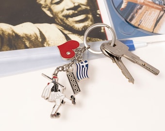 Handcrafted Keychains Featuring The figure of Tsolia( The Greek Guardian) a Heart and Greek Flag Crafted from Metal and Enamel–Hellenic