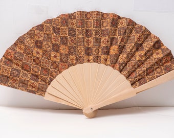 Handheld fan made of colorful natural cork and wood. A beautiful natural cork fan that will keep you cool and stylish at the same time