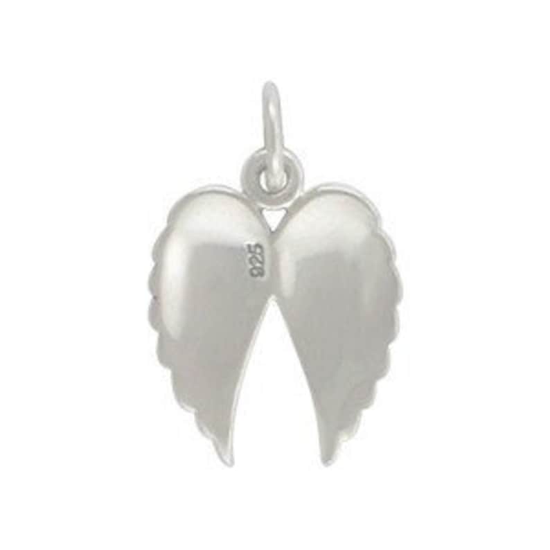 May include: A silver-colored charm in the shape of angel wings. The charm has a loop at the top for attaching to a necklace or bracelet. The wings are detailed with feather-like textures and the number "925" is visible.
