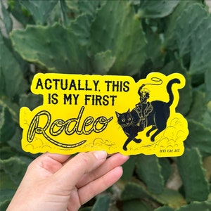 Actually, This Is My First Rodeo - Bumper Sticker! yallternative rodeo black cat howdy southern goth western texas tattoo cowboy critters
