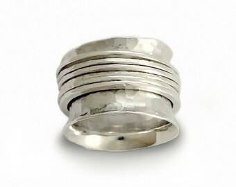 Wide hammered silver band with spinners