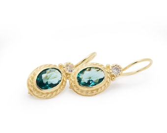 Elegantes gotas de topacio azul ovalado