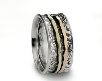 Mixed metals floral spinner ring