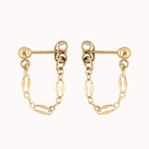 May include: A pair of gold chain earrings with a small ball at the end of each chain.