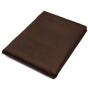 May include: A brown fabric tablecloth with a subtle textured pattern.