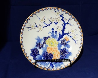 Beautiful vintage collectible Japanese plate with a cherry blossoms and flower design.