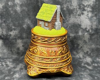 Folklore cabin faux snow globe figurine