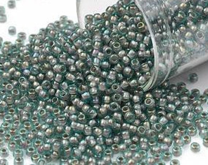 11/0 Toho Seed Beads, Brick Lined Aqua Rainbow (1851), 10 grams, About 1110 Round Seed Beads, 2.2mm with .8mm Hole, Rainbow Finish