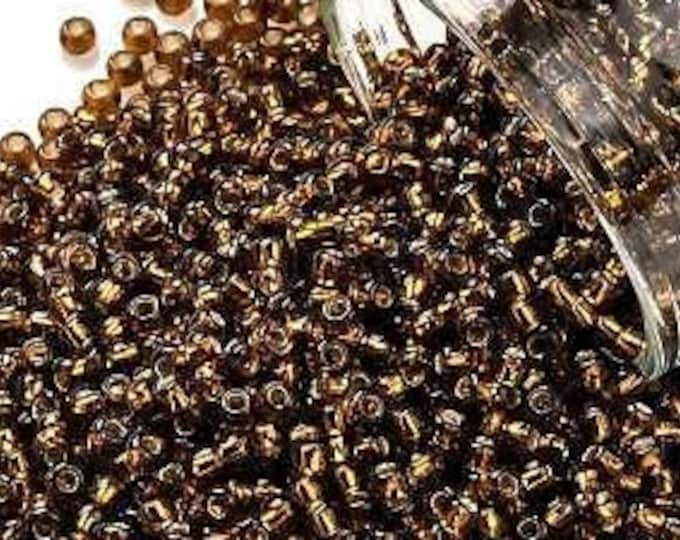 11/0 Toho Seed Beads, Silver Lined Smoky Topaz (34), 10 grams, About 1103 Round Seed Beads, 2.2mm with .8mm Hole, Frost Finish