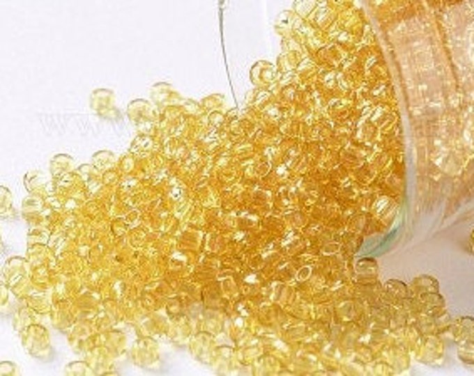 11/0 Toho Seed Beads, Transparent Light Topaz (2), 10 grams, About 1110 Round Seed Beads, 2.2mm with .8mm Hole, Transparent Finish