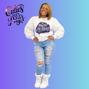 May include: A white sweatshirt with the text "Faith That Aligns" in purple and blue, paired with light blue ripped jeans and white boots. The sweatshirt has long sleeves and a crew neck. The image also shows the logo "Culies by E's Png's".