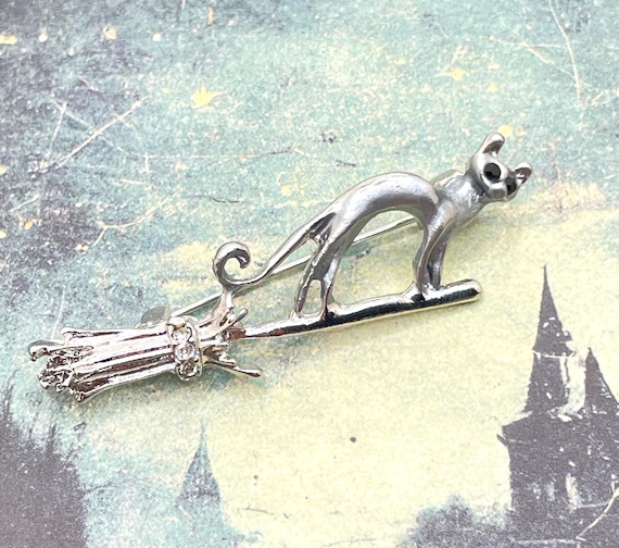 Adorable Halloween Cat on Broomstick Rhinestone Pin | Silver Tone