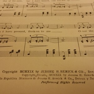 May include: A vintage sheet music page with the title "Over the Sea" and lyrics "hands I have pressed, Beck-on to me" and "waiting for me". The copyright information is for MCMXIX by Jerome H. Remick & Co., Detroit & New York.