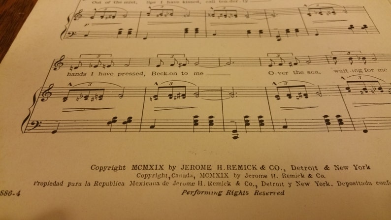 May include: A vintage sheet music page with the title "Over the Sea" and lyrics "hands I have pressed, Beck-on to me" and "waiting for me". The copyright information is for MCMXIX by Jerome H. Remick & Co., Detroit & New York.