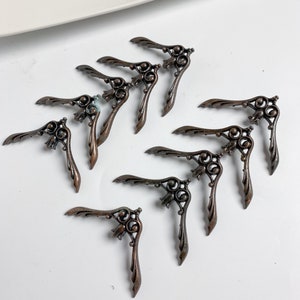 Set of 10 vintage metal Cabinet Door Pull Handles, lot, dark painted metal, wings