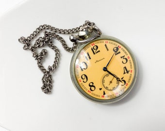 Vintage antique mechanical pocket watch Molnia with chain, metal case, original retro finging 1970-1980s, tallship, Navy