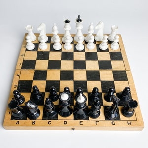 Vintage plastic Chess Game with wooden board, retro style