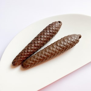 May include: A rustic wooden sign with the text "Welcome to our home" in white lettering. The sign features a distressed finish and a simple, inviting design, perfect for entryway decor.