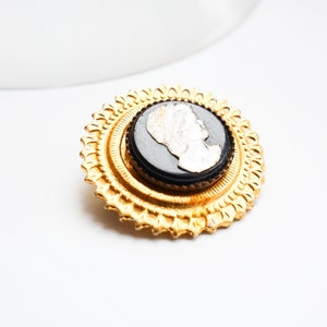 Vintage small brass brooch with Plastic Cameo